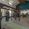 large room with lots of exercise equipment