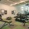large room with lots of exercise equipment