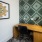 small room with table and wallpaper