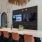 bar with many seats and tvs