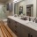 bathroom with bathtub and large mirror