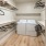 closet with hangers and washer and dryer