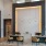 large illumined wall with chairs and tables